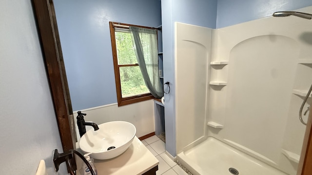 30 Zuidema Ct, Kalamazoo, MI 49001 - full bath featuring a stall shower, tile patterned floors, and vanity
