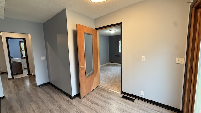 30 Zuidema Ct, Kalamazoo, MI 49001 - hallway with light wood finished floors and baseboards