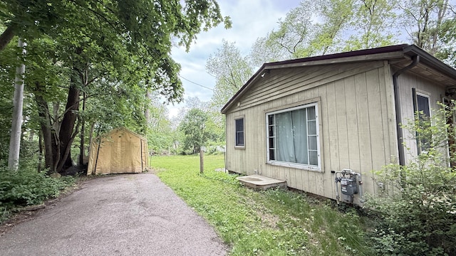 30 Zuidema Ct, Kalamazoo, MI 49001 - view of side of property with a yard and asphalt driveway