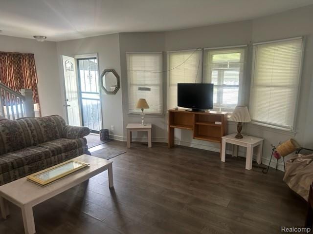164 E Hamilton Ave, Flint, MI 48505 - living room with dark wood-type flooring and baseboards