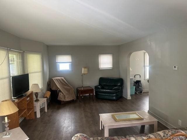 164 E Hamilton Ave, Flint, MI 48505 - living area featuring arched walkways and wood finished floors