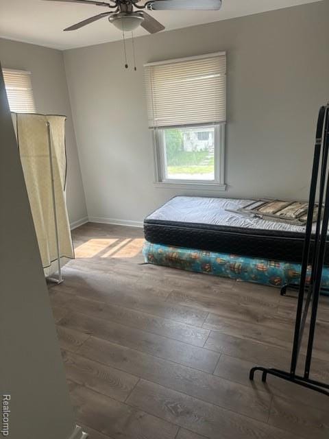 164 E Hamilton Ave, Flint, MI 48505 - bedroom featuring multiple windows, wood finished floors, and ceiling fan