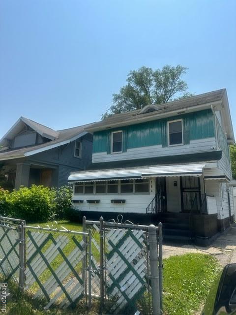 164 E Hamilton Ave, Flint, MI 48505 - view of front of property with a fenced front yard, a gate, and covered porch
