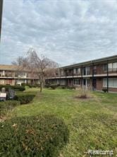 25301 5 Mile Rd, Detroit, MI 48239 - view of home's community featuring a lawn