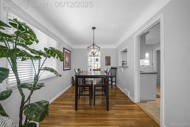 2195 Pembroke Rd, Birmingham, MI 48009 - dining room with plenty of natural light, a chandelier, and wood finished floors