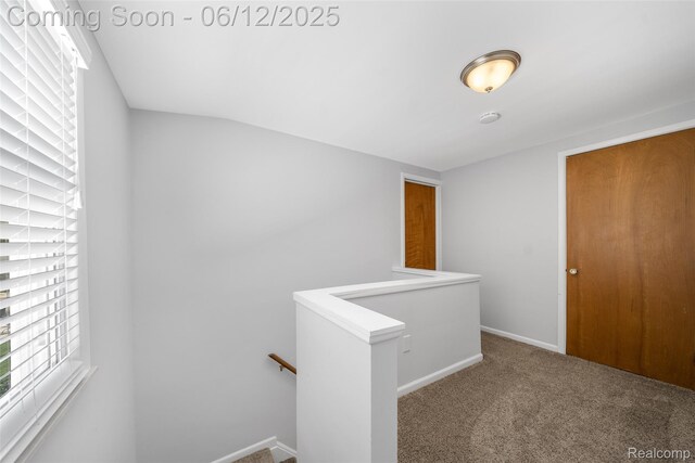 2195 Pembroke Rd, Birmingham, MI 48009 - corridor with an upstairs landing, carpet flooring, and baseboards