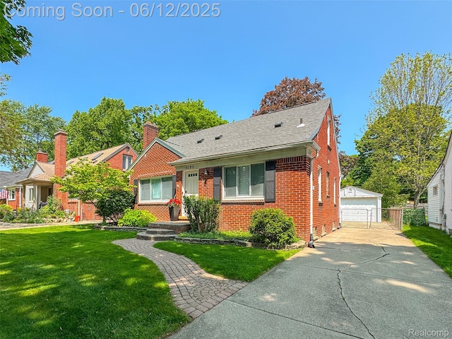 2195 Pembroke Rd, Birmingham, MI 48009 - bungalow-style home with brick siding, an outbuilding, a front lawn, a detached garage, and roof with shingles