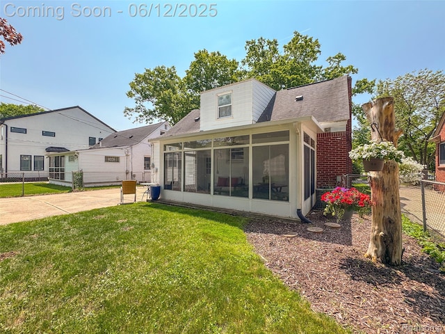 2195 Pembroke Rd, Birmingham, MI 48009 - rear view of house featuring a sunroom and a shingled roof