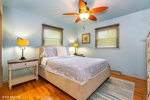 1787 Trafalgar Dr, Saint Joseph, MI 49085 - bedroom with wood finished floors, baseboards, and a ceiling fan