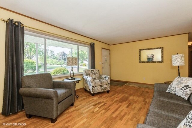 1787 Trafalgar Dr, Saint Joseph, MI 49085 - living room with light wood-type flooring, crown molding, and baseboards