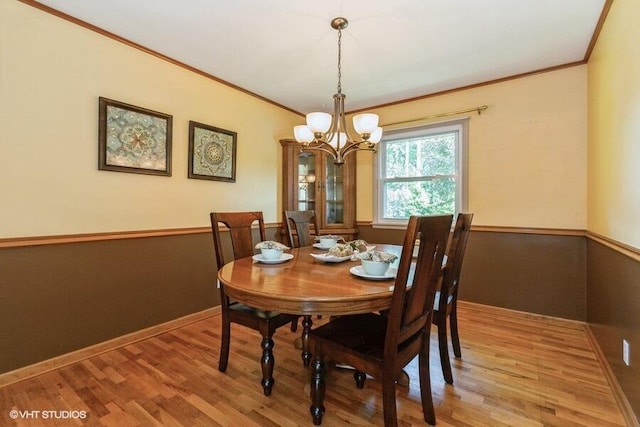 1787 Trafalgar Dr, Saint Joseph, MI 49085 - dining space featuring a chandelier, ornamental molding, light wood-type flooring, and baseboards