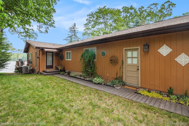1704 Clark Lake Rd, Brighton, MI 48114 - view of exterior entry with a yard and cooling unit