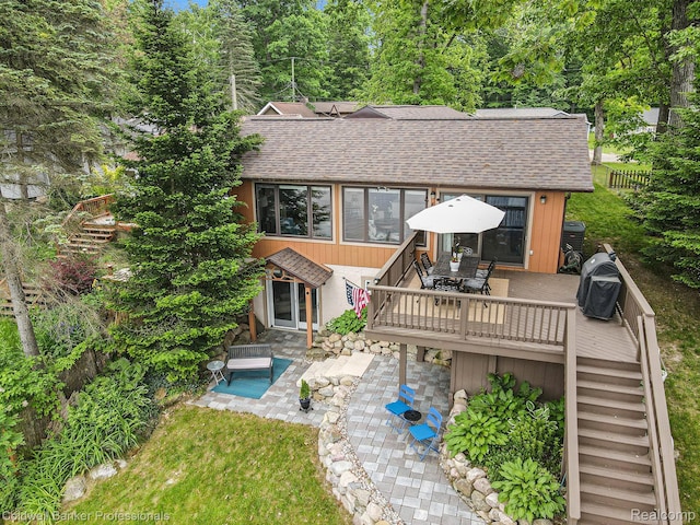 1704 Clark Lake Rd, Brighton, MI 48114 - back of house with roof with shingles, a deck, stairs, outdoor dining space, and a patio
