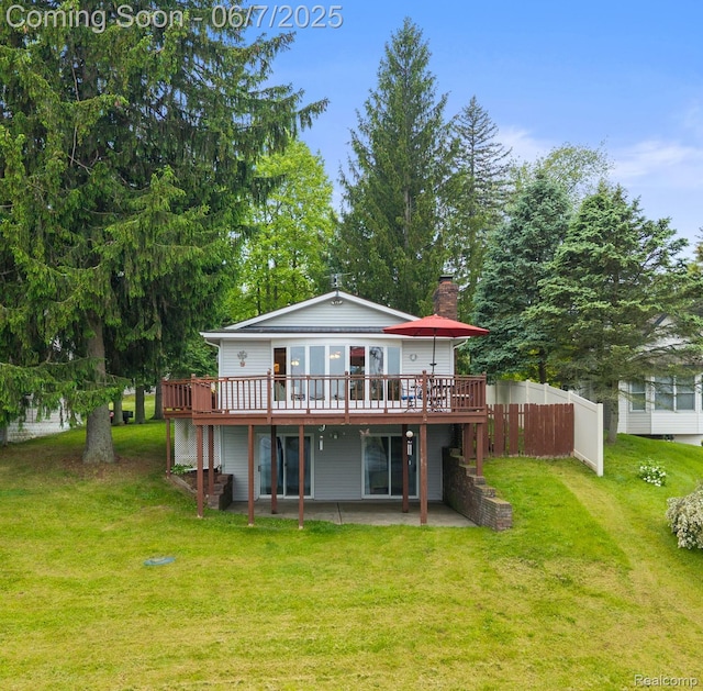 6300 Bullard Rd, Fenton, MI 48430 - rear view of property featuring a patio, a wooden deck, and a chimney