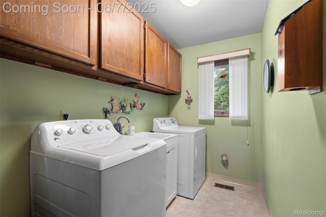 6300 Bullard Rd, Fenton, MI 48430 - laundry area with cabinet space, independent washer and dryer, baseboards, and light tile patterned flooring