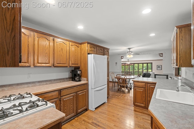 6300 Bullard Rd, Fenton, MI 48430 - kitchen featuring freestanding refrigerator, a ceiling fan, light countertops, a sink, and recessed lighting