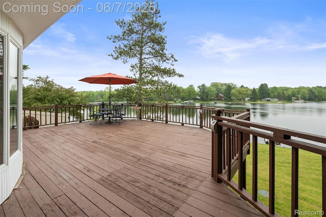 6300 Bullard Rd, Fenton, MI 48430 - wooden deck featuring a water view and outdoor dining space