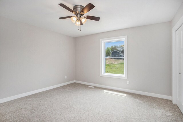 10230 E Hj Ave, Galesburg, MI 49053 - empty room with carpet floors, baseboards, and ceiling fan
