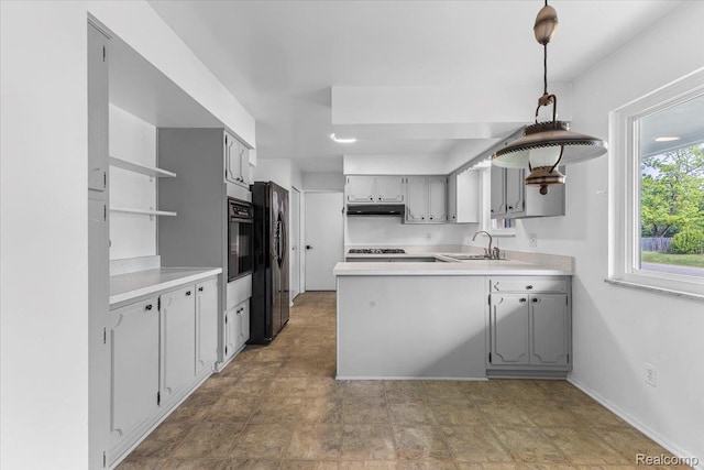 2985 Lacota Rd, Farmington, MI 48328 - kitchen featuring open shelves, a sink, gray cabinets, a peninsula, and under cabinet range hood