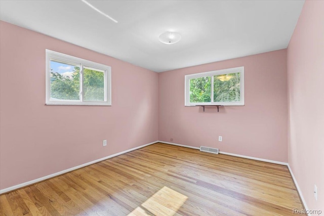2985 Lacota Rd, Farmington, MI 48328 - spare room with wood finished floors and baseboards