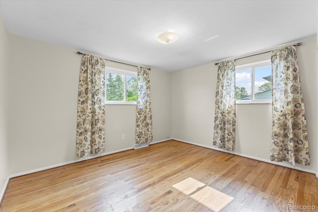 2985 Lacota Rd, Farmington, MI 48328 - empty room with wood finished floors and baseboards