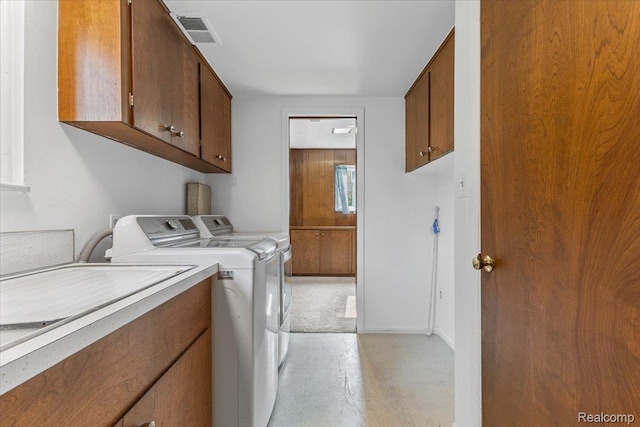 2985 Lacota Rd, Farmington, MI 48328 - laundry area with independent washer and dryer and cabinet space