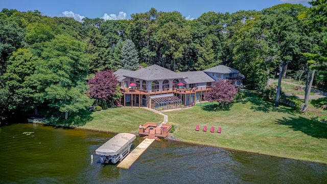 4298 Braeburn Ct, Norton Shores, MI 49441 - aerial view of property and surrounding area with a large body of water and a heavily wooded area