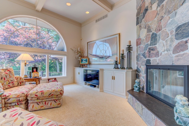 4298 Braeburn Ct, Norton Shores, MI 49441 - living area featuring beam ceiling, carpet flooring, a stone fireplace, and a high ceiling