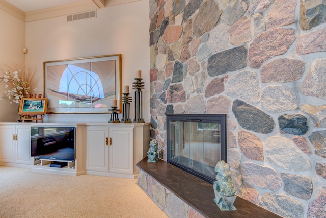 4298 Braeburn Ct, Norton Shores, MI 49441 - carpeted living room with a stone fireplace and ornamental molding