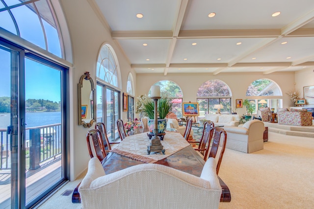 4298 Braeburn Ct, Norton Shores, MI 49441 - carpeted dining room with coffered ceiling, plenty of natural light, beam ceiling, recessed lighting, and a water view