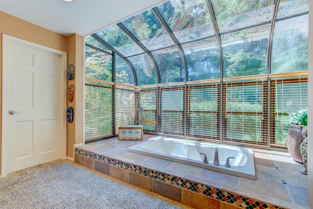 4298 Braeburn Ct, Norton Shores, MI 49441 - bathroom featuring a garden tub and plenty of natural light