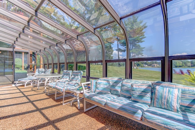 4298 Braeburn Ct, Norton Shores, MI 49441 - sunroom featuring vaulted ceiling, a water view, and a jacuzzi