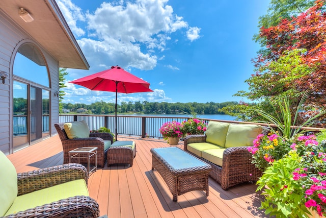 4298 Braeburn Ct, Norton Shores, MI 49441 - wooden deck with outdoor lounge area and a water view