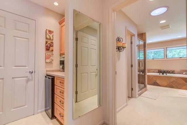4298 Braeburn Ct, Norton Shores, MI 49441 - full bath with a stall shower, a bath, vanity, and recessed lighting