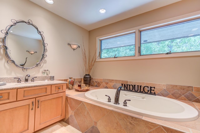 4298 Braeburn Ct, Norton Shores, MI 49441 - full bath featuring vanity, a garden tub, and recessed lighting