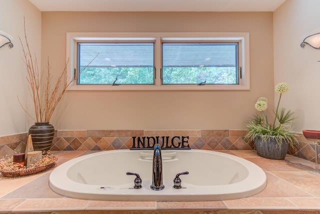 4298 Braeburn Ct, Norton Shores, MI 49441 - bathroom featuring plenty of natural light and a garden tub