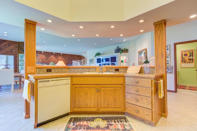 4298 Braeburn Ct, Norton Shores, MI 49441 - kitchen with dishwasher, a sink, recessed lighting, light tile patterned floors, and light countertops