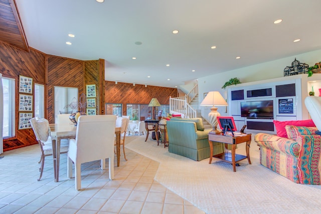 4298 Braeburn Ct, Norton Shores, MI 49441 - dining space with wood walls, stairway, recessed lighting, and light tile patterned floors