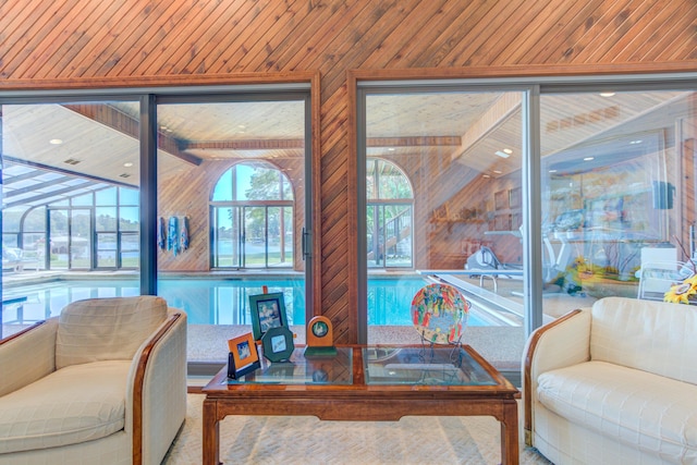 4298 Braeburn Ct, Norton Shores, MI 49441 - living room featuring wood walls and lofted ceiling
