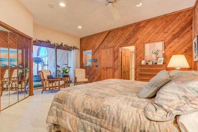 4298 Braeburn Ct, Norton Shores, MI 49441 - bedroom featuring access to exterior, wood walls, recessed lighting, a ceiling fan, and carpet floors