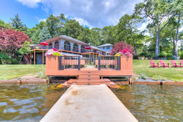 4298 Braeburn Ct, Norton Shores, MI 49441 - dock featuring a yard and a deck with water view