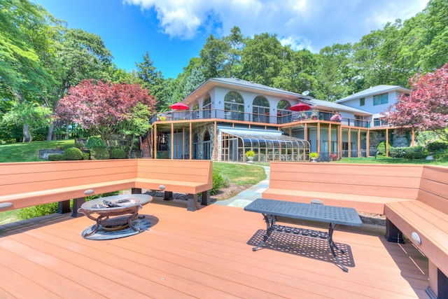 4298 Braeburn Ct, Norton Shores, MI 49441 - wooden terrace featuring an outdoor fire pit