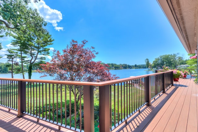 4298 Braeburn Ct, Norton Shores, MI 49441 - deck with a water view and a lawn
