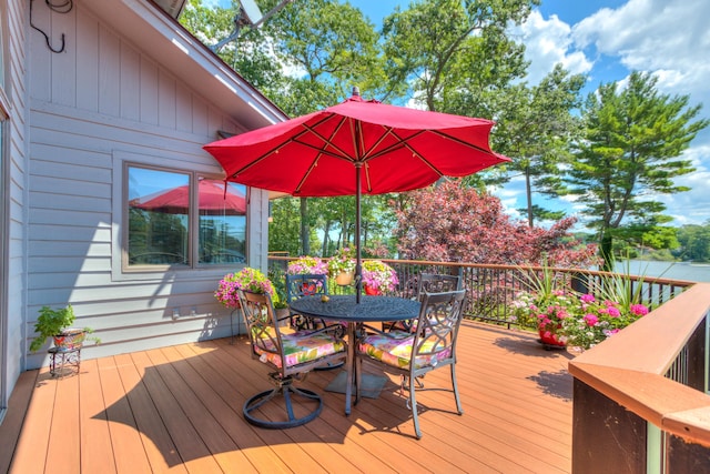 4298 Braeburn Ct, Norton Shores, MI 49441 - wooden deck with outdoor dining area