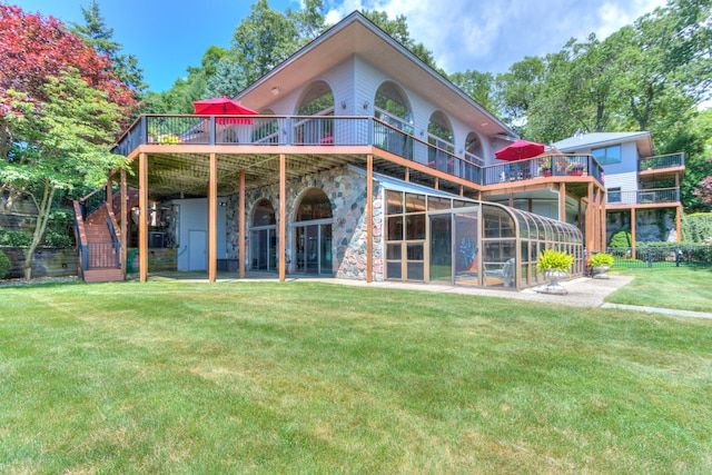 4298 Braeburn Ct, Norton Shores, MI 49441 - back of property with a deck, stairs, and a patio