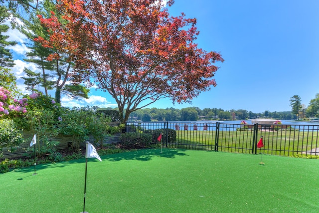 4298 Braeburn Ct, Norton Shores, MI 49441 - view of yard with a putting green and a water view