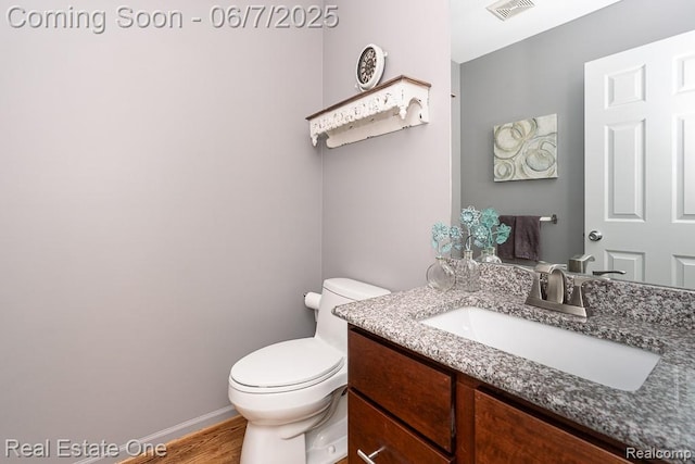 468 Orchard Ridge Dr, Lake Orion, MI 48362 - half bath with vanity, toilet, wood finished floors, and baseboards
