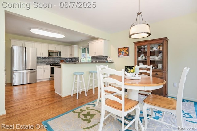 468 Orchard Ridge Dr, Lake Orion, MI 48362 - dining area featuring light wood-type flooring