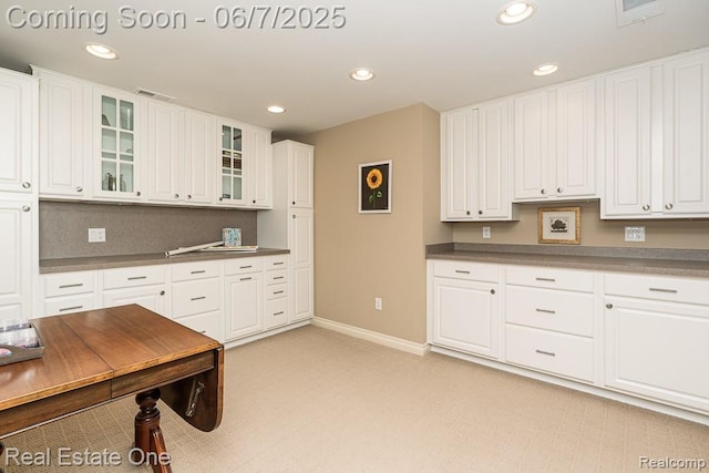 468 Orchard Ridge Dr, Lake Orion, MI 48362 - kitchen featuring baseboards, recessed lighting, white cabinets, glass insert cabinets, and dark countertops