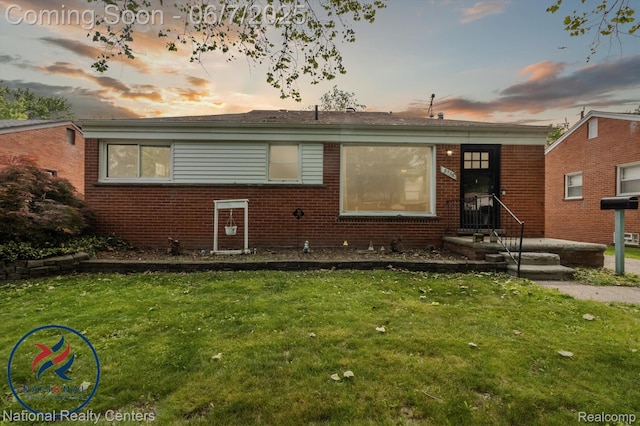 9036 Nathaline, Redford, MI 48239 - view of front facade featuring brick siding and a lawn
